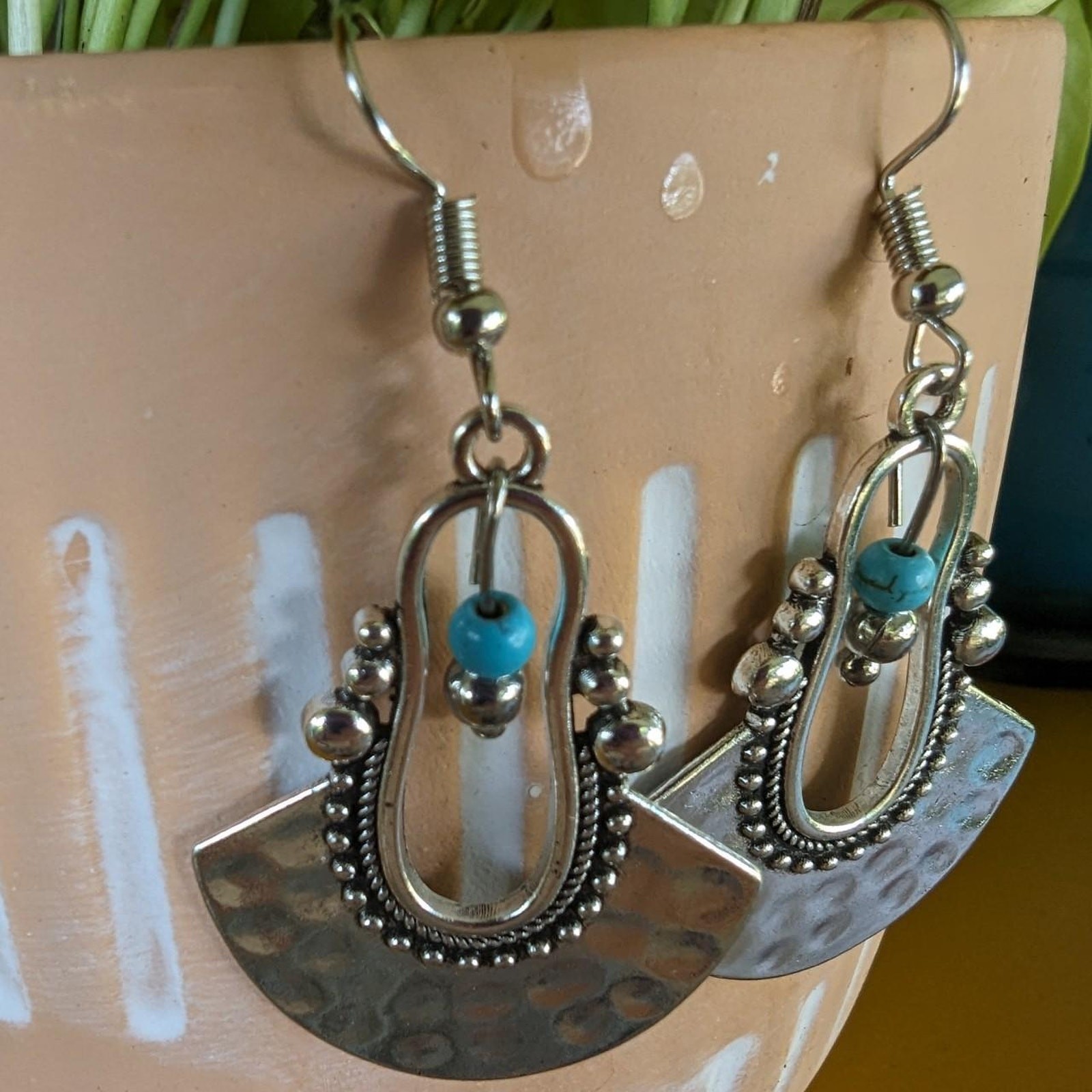 Silver tone dangle earrings