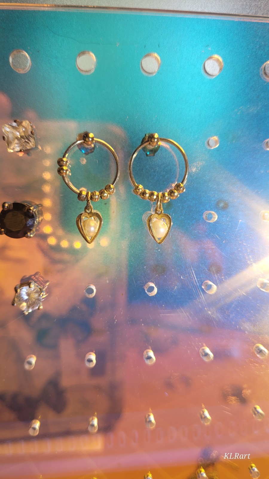 4 pair studs that do sparkle, gold plated pearls, large black Spinal studs