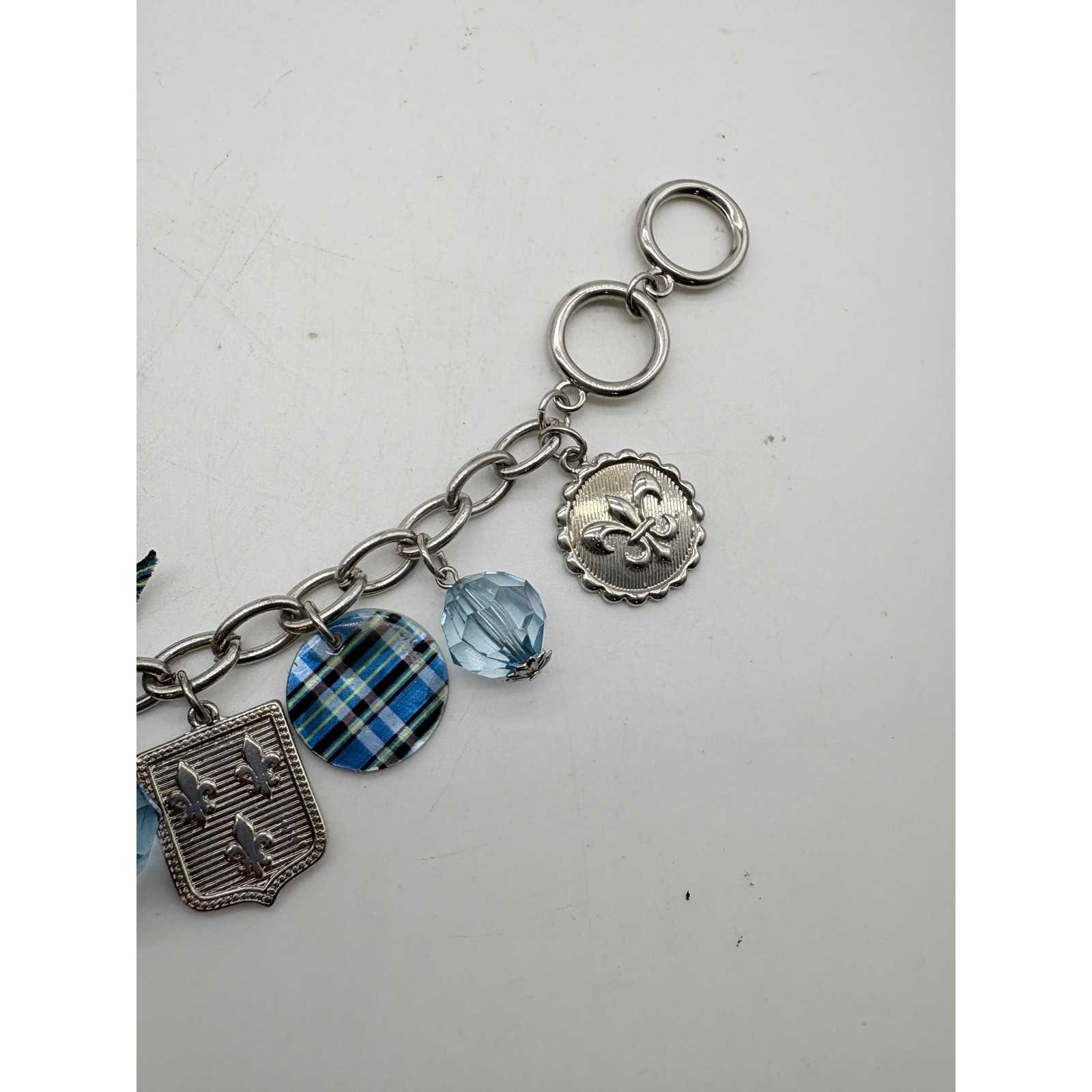 Blue Plaid Fleur De Lis Charm Bracelet Silver Tone Toggle Clasp Glass Bead Bow