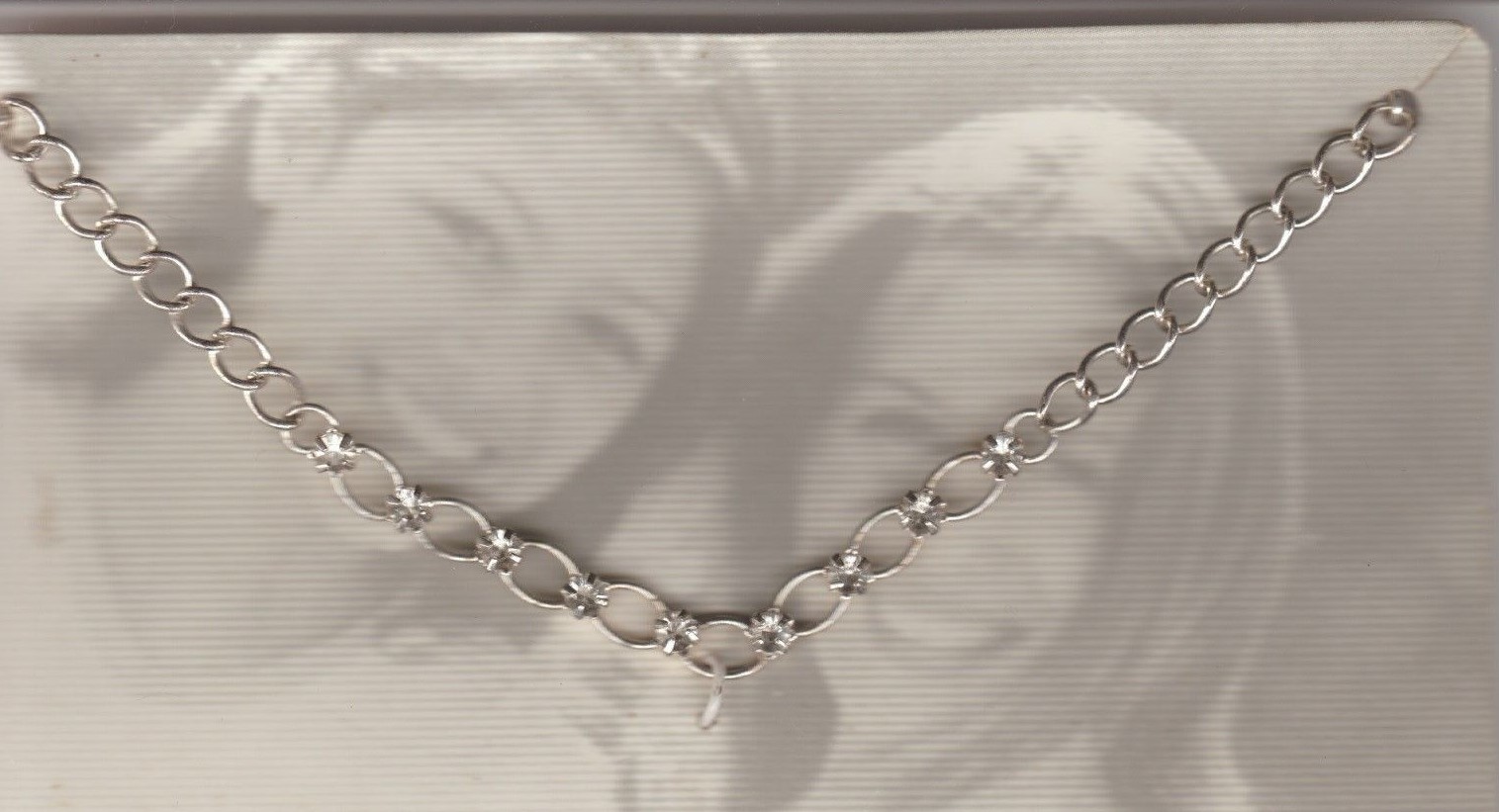 New chain Necklace with 9 small clear synthetic stones See Scan For Picture